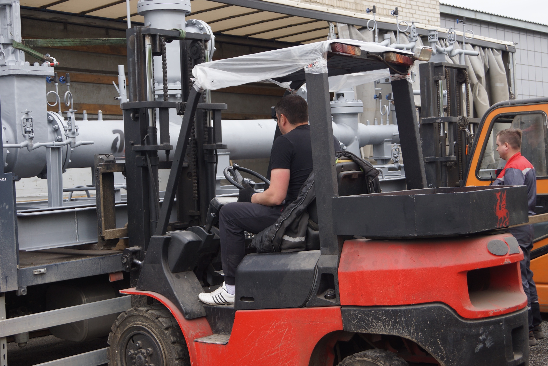 A new forklift is involved in loading PRDS for the customer